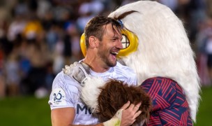 Cam Dolan and Rookie the Eagle celebrate last year's win over Canada. Rookie is on the right. David Barpal photo. 