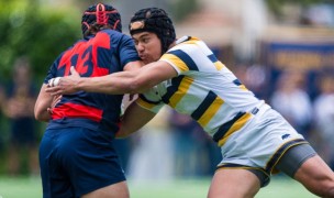 Two players on the West: Rand Santos tackles Dom Besag. Photo David Barpal.