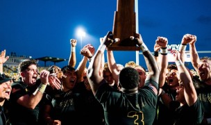 Larry Williams raises the D1A Championship trophy.