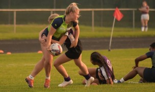 Avery Morgan looks to make an offload in Idaho's girls 7s action.