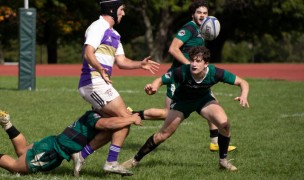 Brendan O'Neill offloads as Shaun Burgos tackles him. Photo Corey Velazquez.