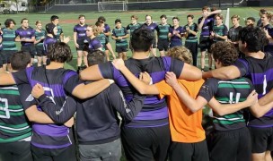 Carlsbad and Mission Vista players huddle up together post-game.