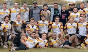 Central Michigan, muddy, tired, and smiling.