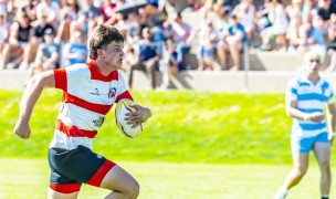 Julian Rowse on his way to paydirt for East. Photo Reid Neureiter.