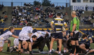 St. Edward, in white, and St. Ignatius, in blue and gold, in last Saturday's game. Jack Nece photo.