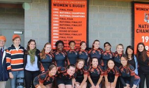 The 2013 Princeton 7s team poses in front of banners touting the programs acheivements.