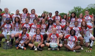 The Lady Raptors celebrate their win.