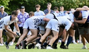 Georgetown Prep in white vs Gonzaga in purple and white hoops. Photo @CoolRugbyPhotos.