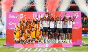 Australia and Fiji celebrate their victories in Dubai. Photo by Zach Franzen / World Rugby.