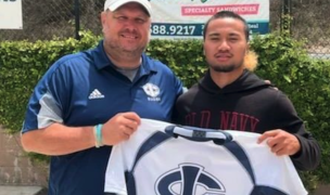 Brent Nelson and Rino Salatielu Teoni Taito'a of Thunder Rugby show off the Iowa Central jersey.