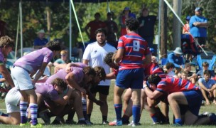Kansas (red and blue) scrums down vs Kansas State. Photo Dean Eslinger.