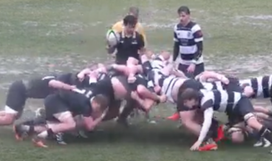 A soggy scrum. (Photo screen grab from YouTube Live Stream.)