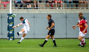 USA's AJ MacGinty boots it downfield for the Eagles against Canada last July. David Barpal photo.