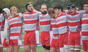 Marist players deal with the weather.