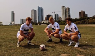 Marquette's leadership poses in front of the Milwaukee skyline.