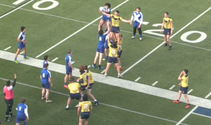 Moeller, in yellow challenges the St. X lineout.