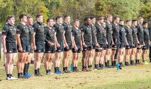 Army stands at attention for the National Anthem. Colleen McCloskey photo.