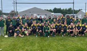 The Northern Michigan team is all smiles after a tough win over UW-Platteville.