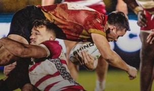 IUP vs Norwich was a wet, rainy battle in the trenches. Photo courtesy NCR.