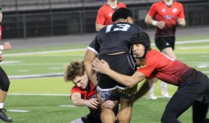San Clemente defends against Jonah Tua of Oceanside. Photo Alex Goff.