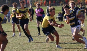 Mark French takes a gap vs Moeller. Alex Goff photo.
