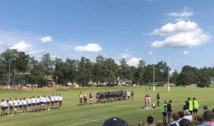 UMW and Penn State line up before the game.