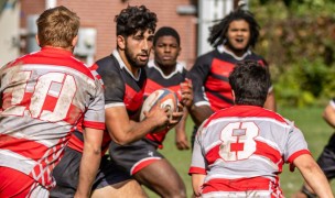 Ray Santiago takes on defenders against Marist. Photo RPI Rugby.