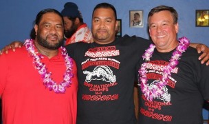 Rob Holder at right celebrating an undefeated season for East Palo Alto.