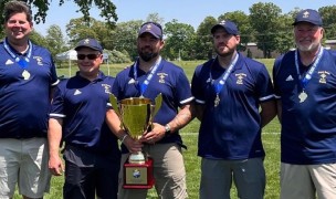 Royal Irish coaches with their state trophy.