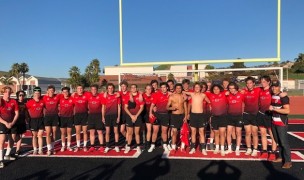 The San Clemente HS team plus Capt. David Pham, USMC, pose after the game. 