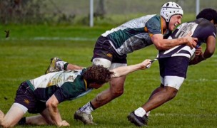 Gavin Maguire making a tackle for SFGG. Photo Shot by 2 Active.