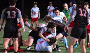 South Meck, in black and red, takes on Charlotte Catholic under the lights. Photo courtesy South Meck Rugby Instagram.