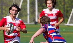 St. John's center Paul Carvajal looks for space against DeMatha.