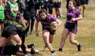 Maggie Sweeney has her eyes on the tryline for St. Joseph Academy. Photo St. Joseph Rugby.