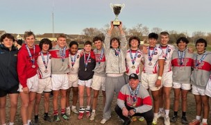 Raptors boys raise the trophy.