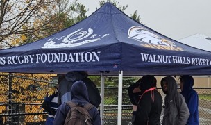 Previous tent recipients Walnut Hills getting shelter against the Ohio rain. Photo Alex Goff.