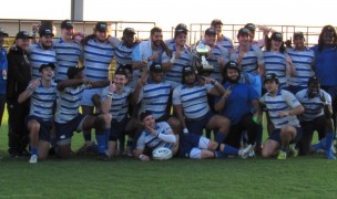 Thomas More players with that pretty trophy. Alex Goff photo.