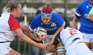 Paige Stathopoulos makes a tackle and Catie Benson helps. Photo Johan Rynners for World Rugby via Getty Images.