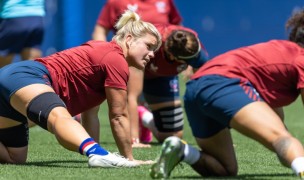 USA players stretching it out. Everyone shows up to the assembly expected to know the details. Alex Ho photo.
