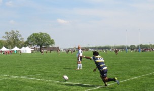 A look at kicking, lots of athletes, and that grass. Alex Goff photo.