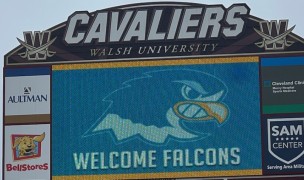 The NDC logo is put on the Walsh University stadium scoreboard to welcome the rugby players when they visited.