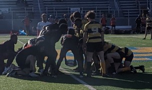 Withrow (black and red) scrums down against Walnut Hills.