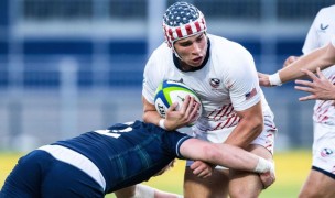 Dom Besag deals with a Scottish tackler. Photo Paul Devlin SNS Group.