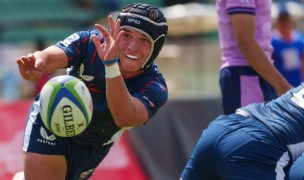 Solomon Williams spins the ball out against Scotland. Photo Antony Munge for World Rugby.