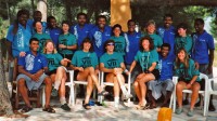 Chris Harju standing, far left and laughing, in Fiji with the Atlantis team in 1992.