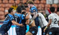 Japan in blue and Fiji in white. Photo World Rugby.