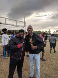 Jacksonville coach Aaron Church with Perry Baker.