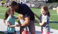 Greg Bruce celebrates Belmont Boys 2019 MIAA state title with niece Rhys and daughters Kai and Zoe.