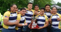 The Barbarians celebrate winning the Washington state title. Sitama is holding the trophy. Clark is the tall guy next to him. 