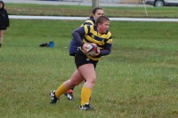 Ready to run, Phillips takes it up. Carmel HS Rugby photo.